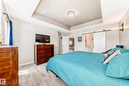 Recessed tray ceiling with central flush-mount light fixture - 3895 Robins Crescent, Edmonton, AB 