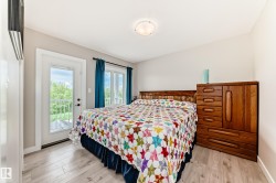 Light wood-finish flooring complements a neutral wall color - 