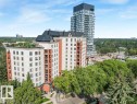 Multi-story residential buildings featuring brick and light-toned facades, black framed windows, and individual balconies - 902 10108 125 Street, Edmonton, AB 