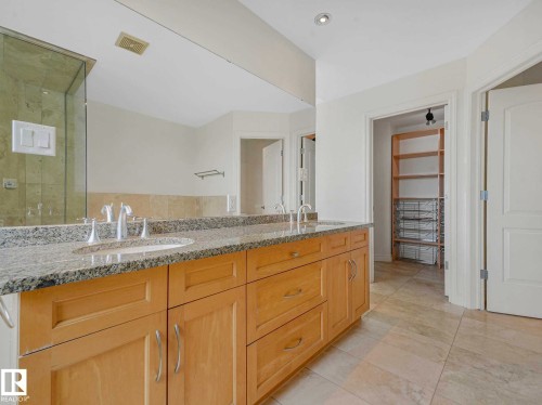 Dual vanity with light wood cabinetry and granite countertops - 902 10108 125 Street, Edmonton, AB 
