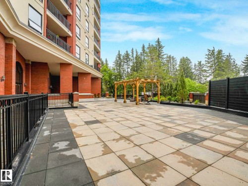 Expansive outdoor patio area featuring a multi-toned paver surface - 902 10108 125 Street, Edmonton, AB 