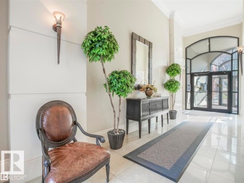 Spacious entryway featuring polished tile flooring and light-toned walls - 902 10108 125 Street, Edmonton, AB 