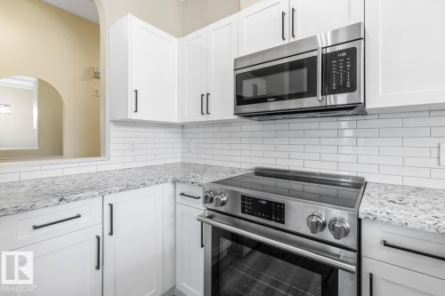 101 8488 111 Street, Edmonton, AB - Indoor Photo Showing Kitchen With Stainless Steel Kitchen With Upgraded Kitchen