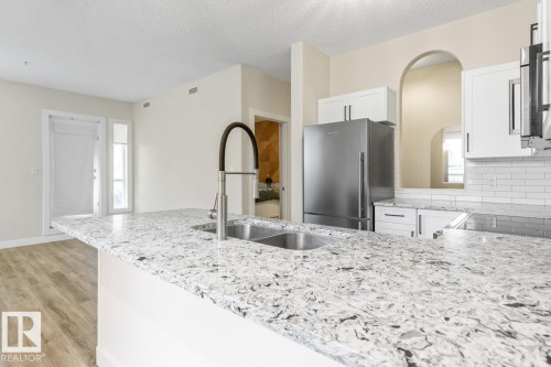 101 8488 111 Street, Edmonton, AB - Indoor Photo Showing Kitchen With Stainless Steel Kitchen With Double Sink With Upgraded Kitchen