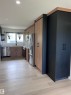 Contemporary kitchen featuring wood-finish flooring, recessed lighting, and a stainless steel appliance suite - 11911 133 Avenue, Edmonton, AB 