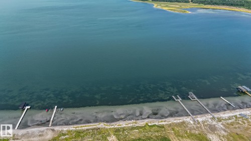 Waterfront property featuring multiple private docks and direct access to the expansive body of water - 104 60201 Rng Rd 122, Rural St. Paul County, AB 
