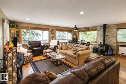 Open concept living area featuring wood-finish flooring and recessed lighting - 104 60201 Rng Rd 122, Rural St. Paul County, AB 