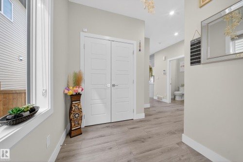 Foyer with light wood-finish flooring, recessed lighting, and a neutral wall palette - 449 Roberts Cres, Leduc, AB 