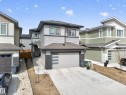Modern two-story residence with a gray siding and dark trim exterior - 449 Roberts Cres, Leduc, AB 