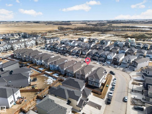 Aerial perspective showcasing a residential development with multiple detached homes - 449 Roberts Cres, Leduc, AB 