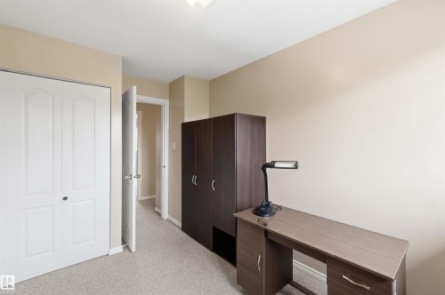 Light-toned carpeting complements neutral wall tones - 17325 85 Avenue Nw, Edmonton, AB 