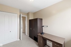 Light-toned carpeting complements neutral wall tones - 