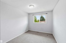 Neutral-toned wall paint and grey carpet flooring - 