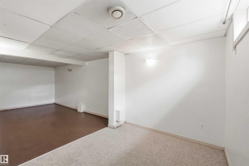 Expansive unfinished room with white painted walls - 17325 85 Avenue Nw, Edmonton, AB 