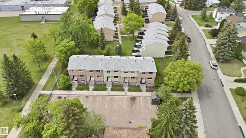 Four residential townhomes featuring individual entrances and ground-level patios - 17325 85 Avenue Nw, Edmonton, AB 