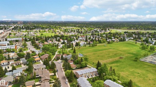 Expansive aerial landscape featuring a residential neighborhood with detached homes and townhomes - 17325 85 Avenue Nw, Edmonton, AB 