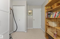 Wall-mounted wooden shelving unit providing storage and display space - 