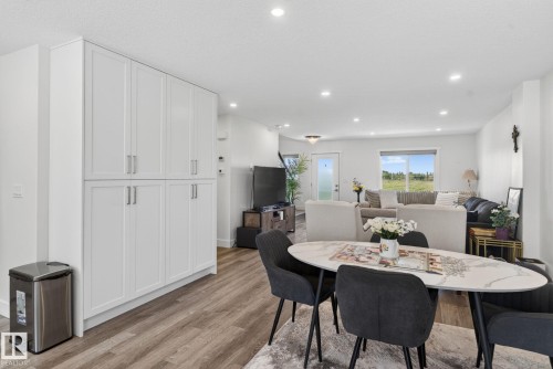 Open-concept living space with recessed lighting and wood-finish flooring - 16 9250 156 Avenue, Edmonton, AB 