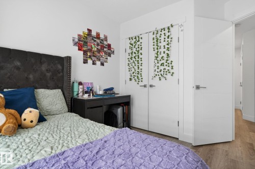 White walls and wood-finish flooring provide a neutral backdrop - 16 9250 156 Avenue, Edmonton, AB 