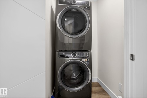 Dedicated laundry area featuring a stacked washer and dryer unit - 16 9250 156 Avenue, Edmonton, AB 