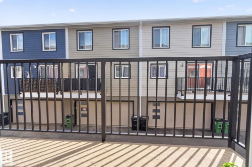 Modern townhome exteriors featuring horizontal siding in varied neutral tones - 16 9250 156 Avenue, Edmonton, AB 