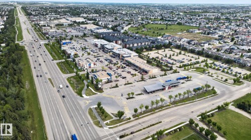 Aerial perspective showcasing a mixed-use commercial and residential district - 16 9250 156 Avenue, Edmonton, AB 