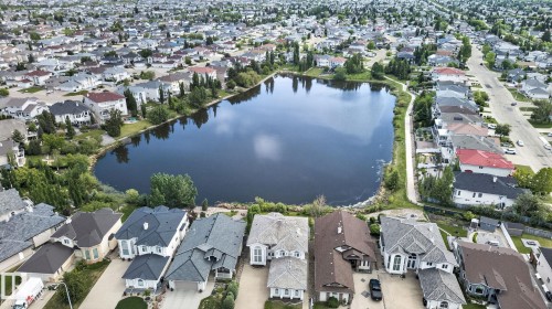 Residential neighborhood featuring a prominent central lake - 16 9250 156 Avenue, Edmonton, AB 