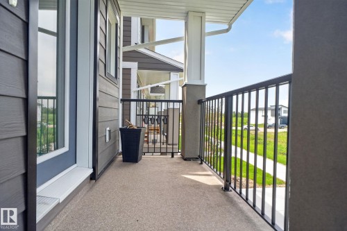 Private balcony featuring durable metal railings and a textured floor finish - 16 9250 156 Avenue, Edmonton, AB 