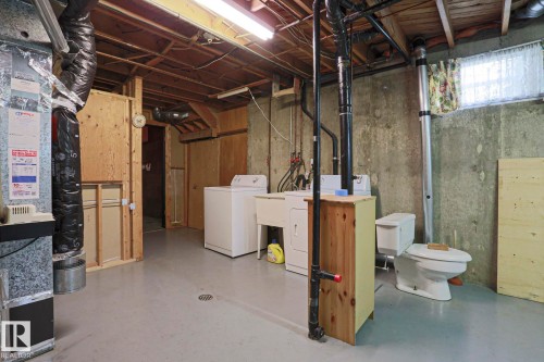 Unfinished basement featuring concrete foundation walls and exposed ceiling joists - 10 Murray Crescent, St. Albert, AB 