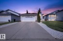 Single-story residence featuring a white exterior with a two-car garage - 946 Jordan Crescent, Edmonton, AB 
