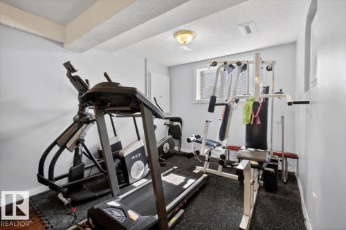 Dedicated room featuring light gray walls and a textured ceiling - 946 Jordan Crescent, Edmonton, AB 