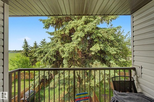 Balcony featuring metal railing, vinyl siding, and a soffit ceiling - 45 2020 105 Street, Edmonton, AB 