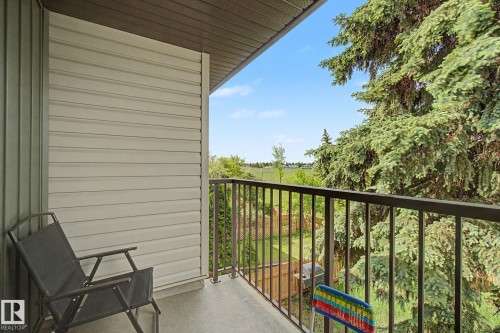 Outdoor balcony featuring a metal railing and concrete flooring - 45 2020 105 Street, Edmonton, AB 