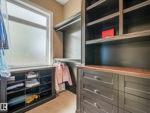Custom built-in closet system featuring dark wood-finish cabinetry - 2807 Wheaton Drive, Edmonton, AB 