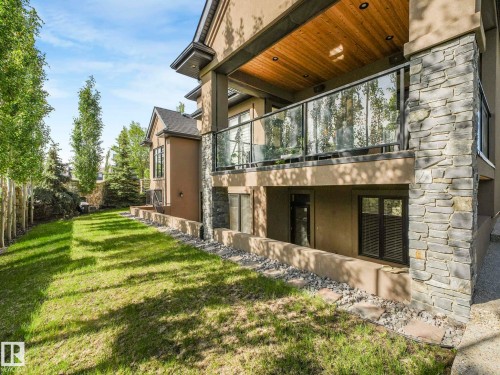 Multi-level dwelling with a stacked stone facade and stucco finish - 2807 Wheaton Drive, Edmonton, AB 