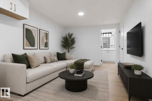 Bright living area featuring light wood-finish flooring - 105 Wyatt Ridge, Fort Saskatchewan, AB 