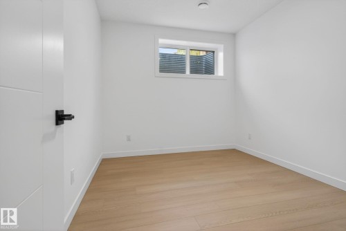 Neutral white walls with matching trim and wood-finish flooring - 105 Wyatt Ridge, Fort Saskatchewan, AB 