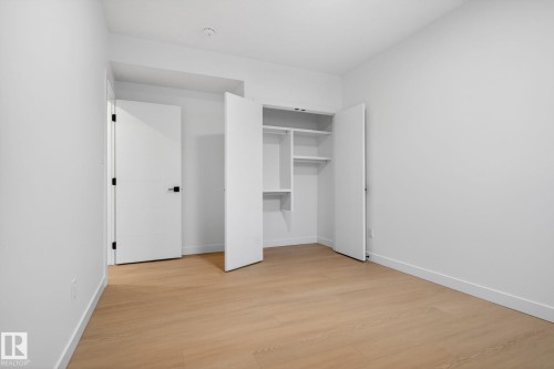 Room featuring light wood-finish flooring and crisp white walls - 105 Wyatt Ridge, Fort Saskatchewan, AB 