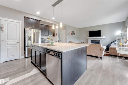 5930 19A Avenue, Edmonton, AB - Indoor Photo Showing Kitchen With Fireplace With Stainless Steel Kitchen With Upgraded Kitchen