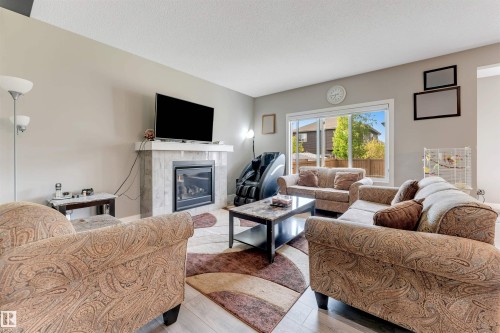 5930 19A Avenue, Edmonton, AB - Indoor Photo Showing Living Room With Fireplace