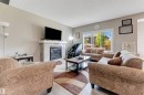 5930 19A Avenue, Edmonton, AB  - Indoor Photo Showing Living Room With Fireplace 