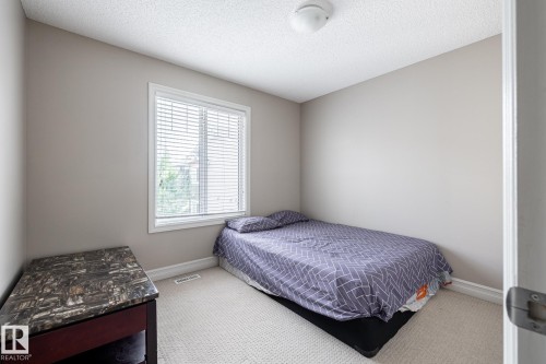 Neutral wall tones with white trim and carpeting - 59 655 Tamarack Road, Edmonton, AB 
