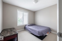 Neutral wall tones with white trim and carpeting - 