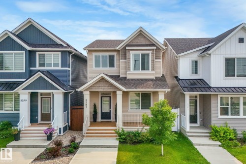 Two-story residence featuring light beige horizontal siding and shake accents - 5281 Edgemont Boulevard Nw, Edmonton, AB - Outdoor With Facade