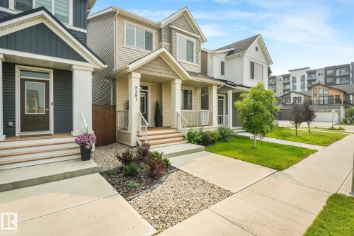 Contemporary exterior with light-toned siding and dark trim accents - 5281 Edgemont Boulevard Nw, Edmonton, AB - Outdoor With Facade