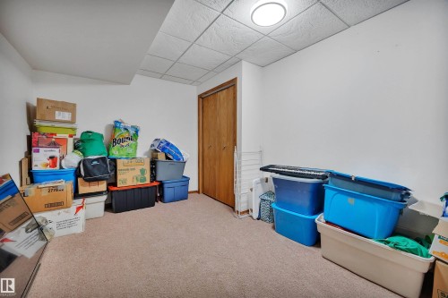 Carpeted room with a drop ceiling and recessed lighting - 16512 87 Street, Edmonton, AB 