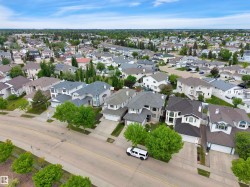 Residential neighborhood featuring multiple detached homes with varying architectural styles - 