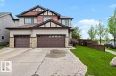 Two-story residence featuring light-toned siding and red-toned shake accents - 13004 164 Avenue, Edmonton, AB 