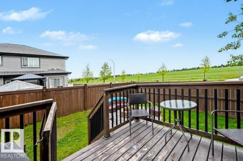Spacious wood-finish deck with dark railings - 13004 164 Avenue, Edmonton, AB 