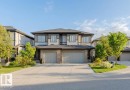 Duplex property featuring modern architectural elements and a dark shingle roof - 2921 Anderson Crest, Edmonton, AB 